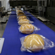 Pastries being packaged at a flight catering facility, 2019